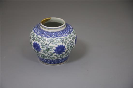 A rare Chinese doucai lotus flower jar, Wanli six character mark and probably of the period, (1573-1619), H. 9.5cm, D. 10.8cm, later